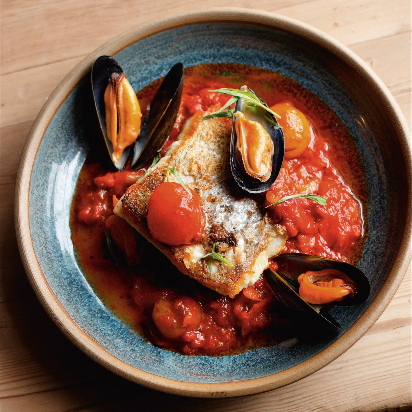 Hake and mussels poached in summer tomatoes